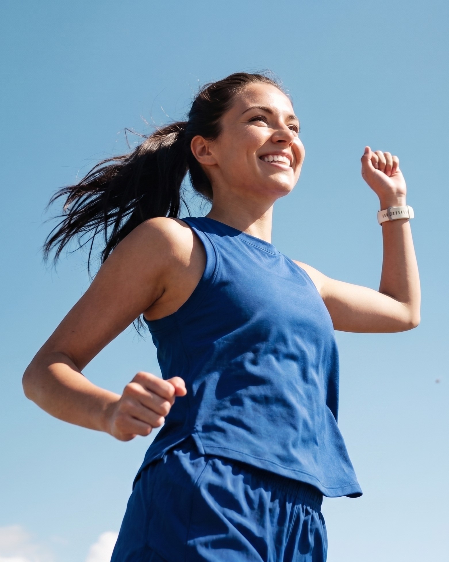 Smiling woman running outdoors